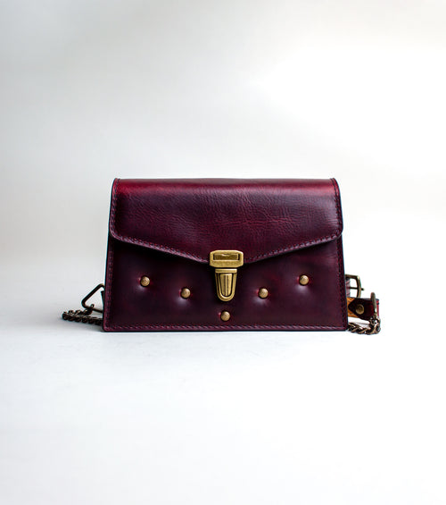 Front-View-of-small-padded-handmade-luxury-purse-made-out-of-dark-red-italian-leather-by-duncan-maxwell